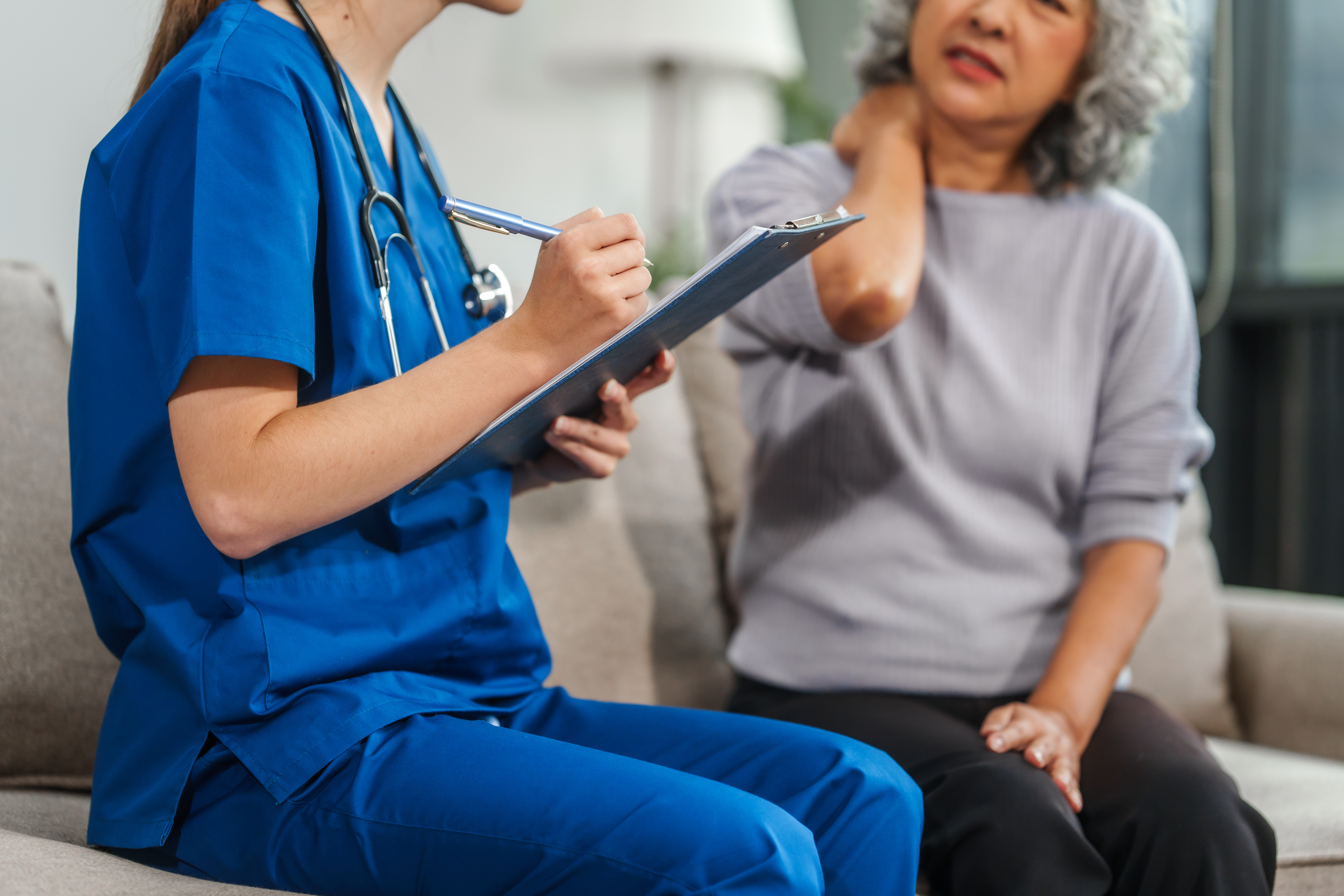 woman in pain being helped by provider